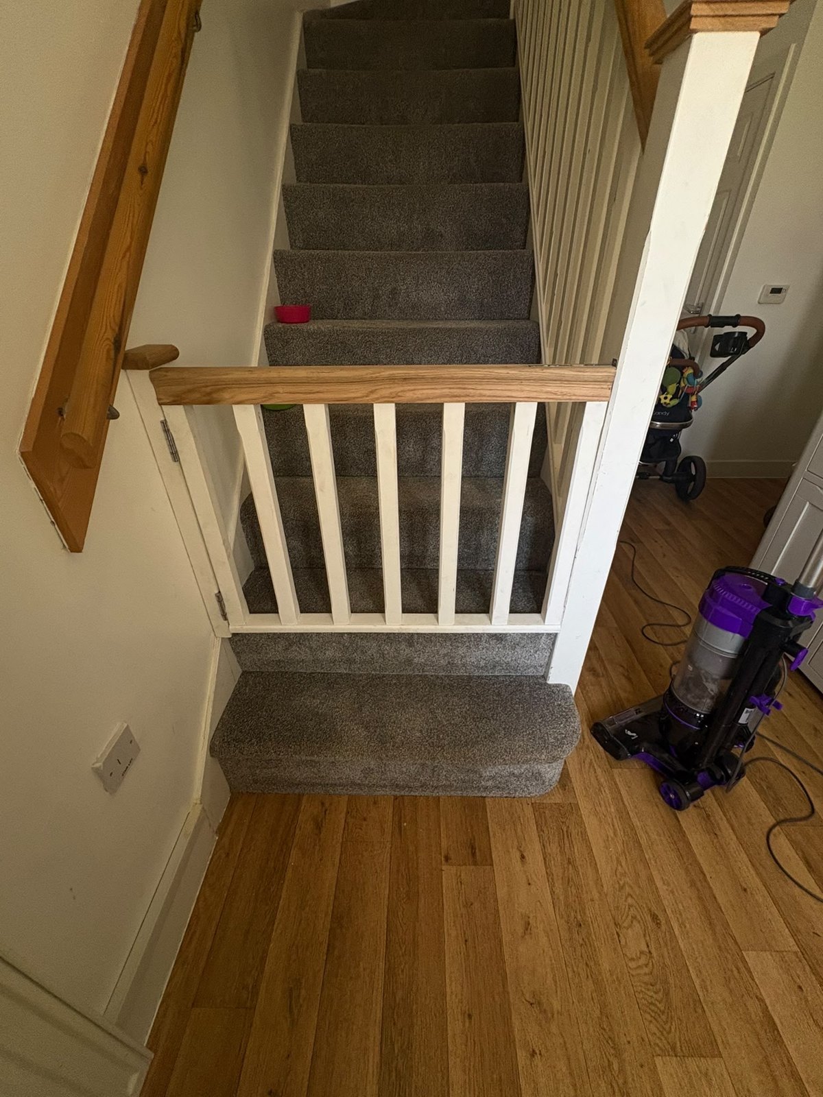 White landing balustrade beside a staircase