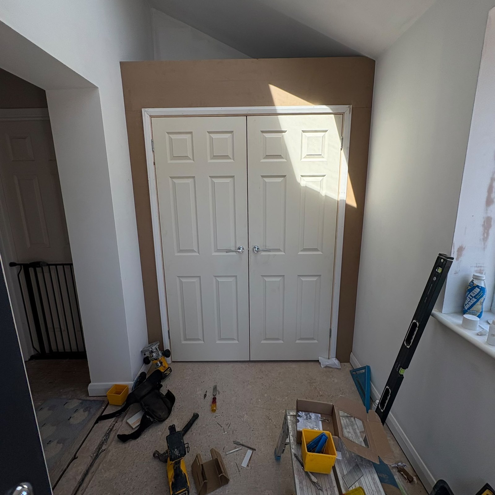 White panelled double doors fitted in an interior opening